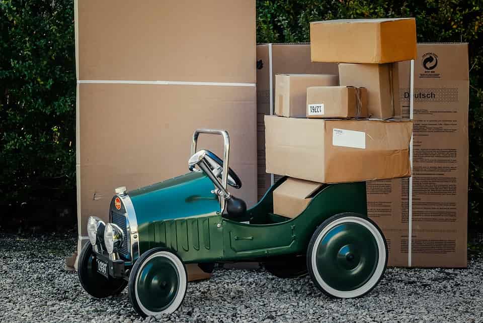 toy car next to large cardboard boxes